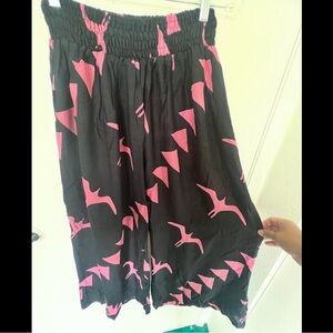 Pink on black flying Iwa